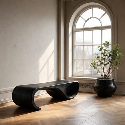Statement hallway seating bench featuring sculpted hollow base and rich black tone finish