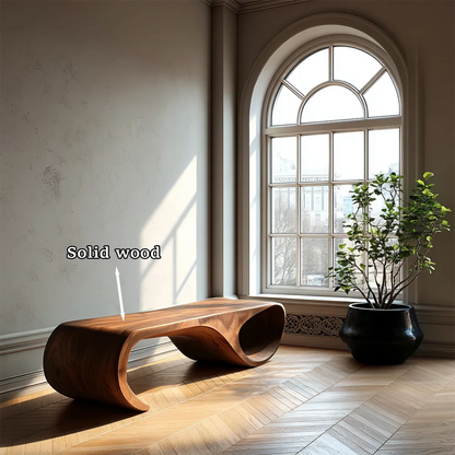 Organic modern bench showcasing flowing loop structure and refined walnut tone finish surface