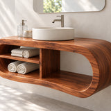 Modern bath vanity in natural solid wood with rounded silhouette and vessel sink