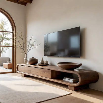 Walnut style TV stand with curved open shelf and smooth flowing design in a modern living room