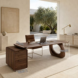 Contemporary desk balances sculptural detailing and practical storage in an airy room