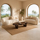 Sculptural coffee table with smooth low profile and rich wood tone finish indoors