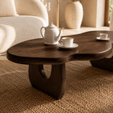 Low living room coffee table in a warm dark wood tone finish with soft curves design