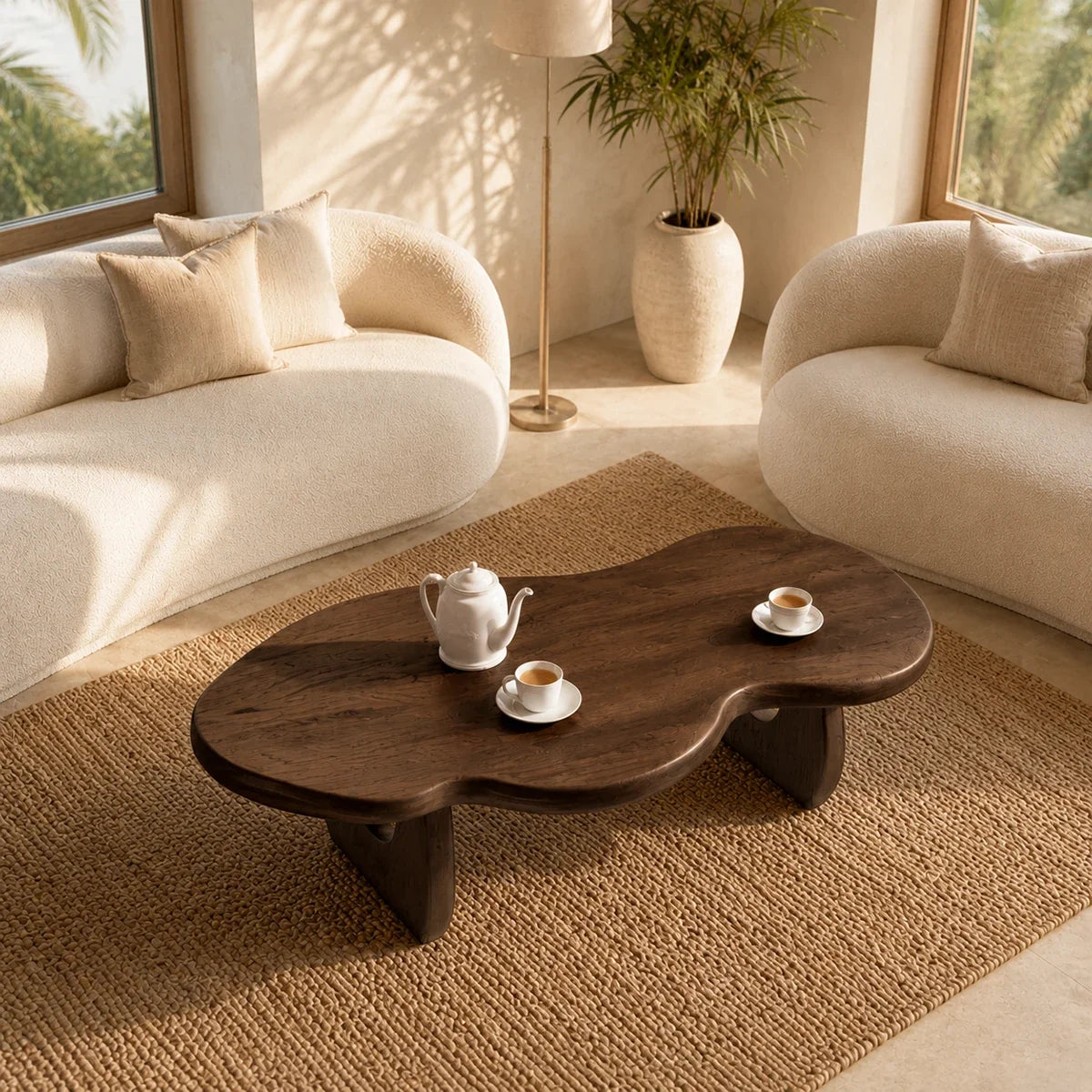 Contemporary center table with organic silhouette and dark wood tone finish detail