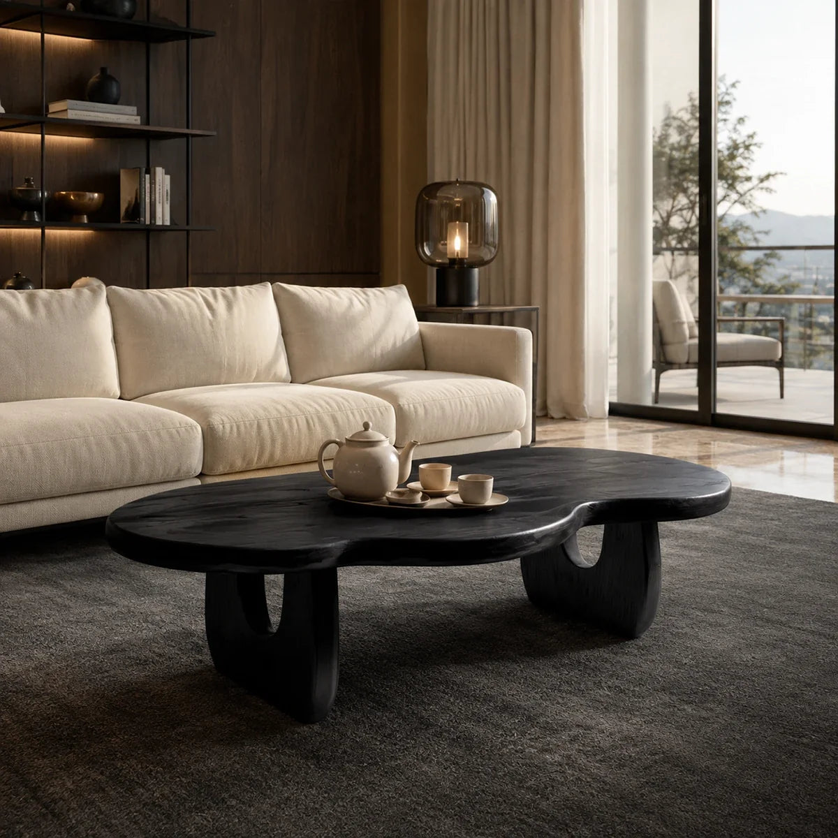 Artisan coffee table with a fluid organic form and dark wood tone finish indoors