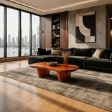 Organic modern coffee table with soft edges and sculpted legs in a refined living room