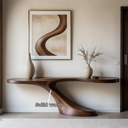 Refined entry space showcasing a modern wood console table with smooth curves and texture