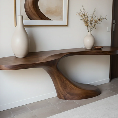 In this contemporary space, a sculptural console table creates a bold and elegant focal point