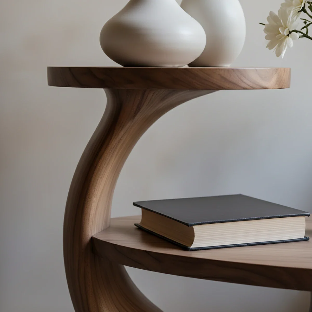 This walnut tone end table showcases a unique circular base and layered shelf structure