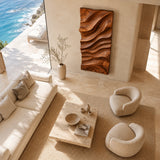 Statement wall art with deep carved curves creates artistic impact above lounge furniture