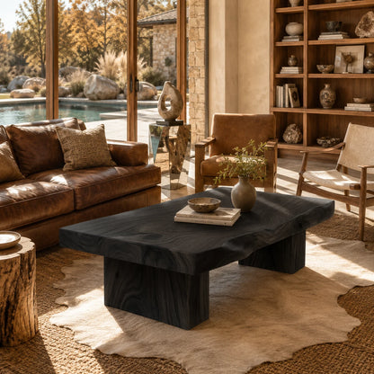 Contemporary coffee table with a wide top and sturdy wood supports in a sunlit beach house