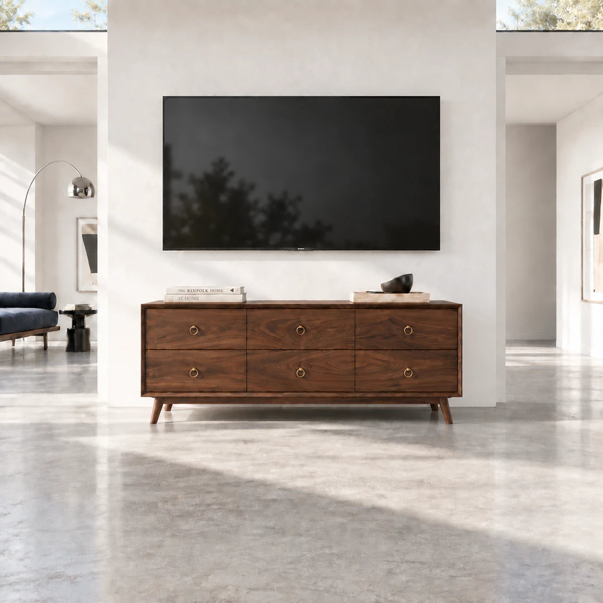 Elegant entertainment cabinet in solid wood with tapered feet and wide drawer fronts
