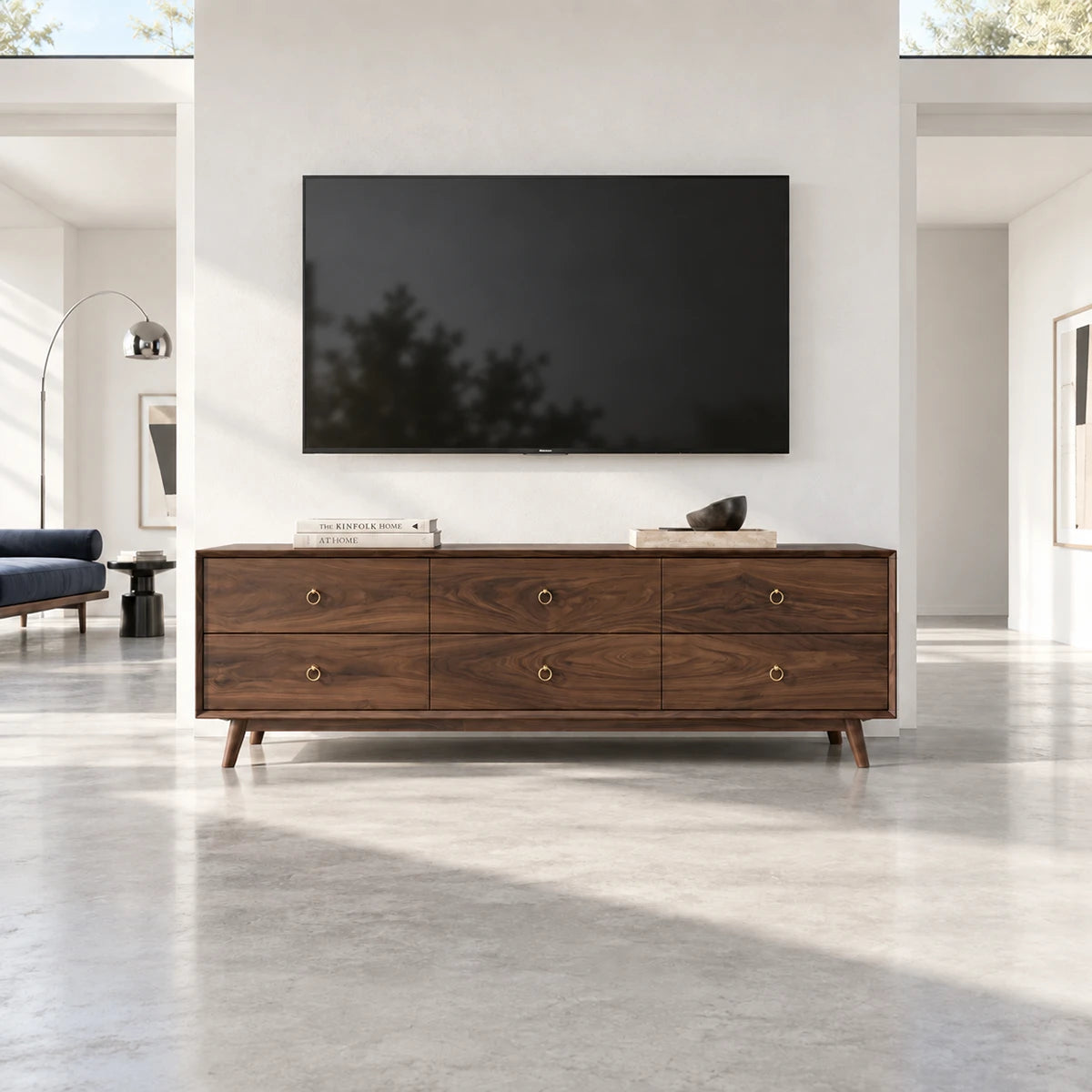 Low profile entertainment center in solid wood with roomy drawers and clean front lines
