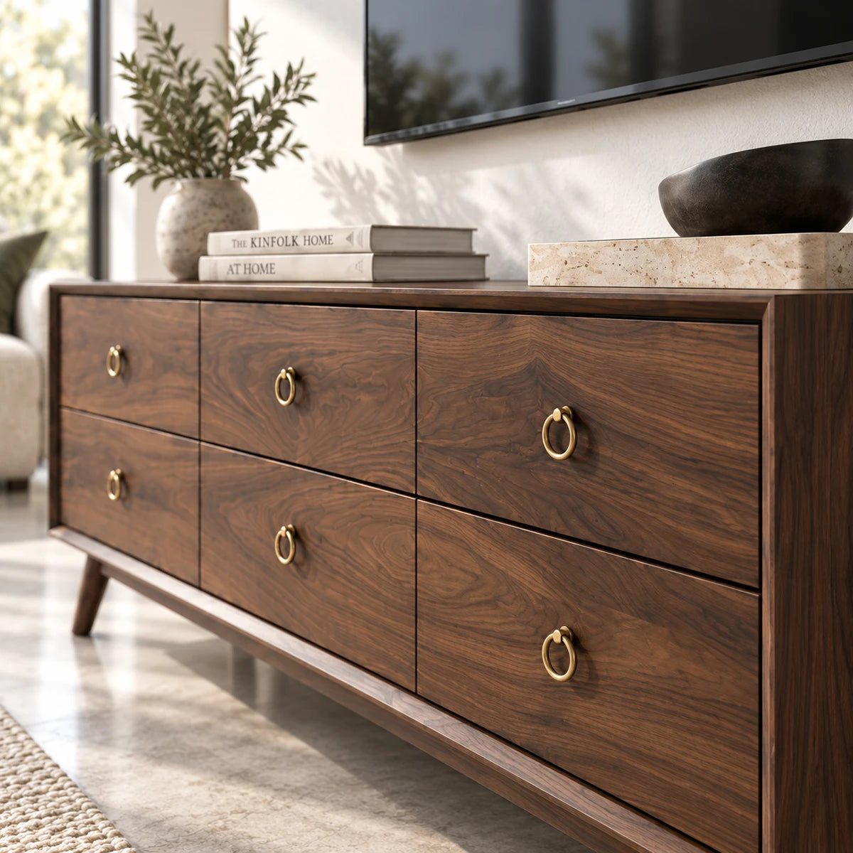 Modern TV console in solid wood with six drawers and elegant brass ring pull accents
