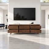 Wide media cabinet in solid wood with tapered legs and generous hidden drawer storage
