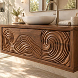 Floating vanity cabinet in natural solid wood defined by bold circular carved frontwork