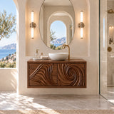 Clean lined vanity unit in natural solid wood with sculpted doors and floating profile