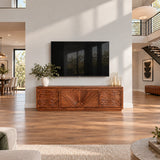 Functional entertainment unit in solid wood with carved wave doors and storage below
