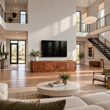 Elegant media console in solid wood with sculpted doors and open display styling
