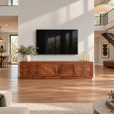 Low profile entertainment center in solid wood with artistic carved front panels
