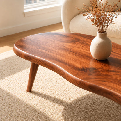 Low profile coffee table with rounded edges and an organic silhouette for airy interiors