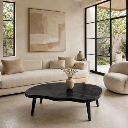 Statement coffee table with an asymmetrical top and refined solid wood craftsmanship