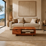 Handcrafted coffee table with built-in drawer and shelf in a soft modern setting