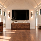 Wide entertainment console in solid wood with textured landscape panel detailing
