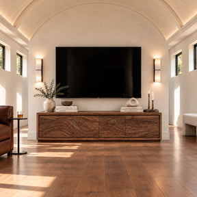 Solid wood TV stand with carved wave front and low-profile living room storage base

