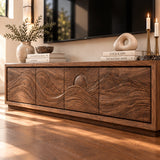 Low-profile TV console in solid wood with wave carving and streamlined storage base
