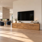 Architectural media stand in solid wood with carved horizon motif and long profile
