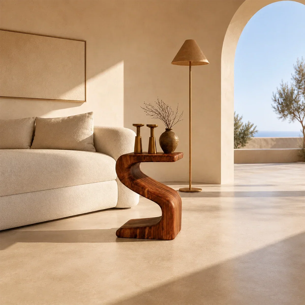 Organic modern side table styled beside soft seating in a calm sunlit interior space