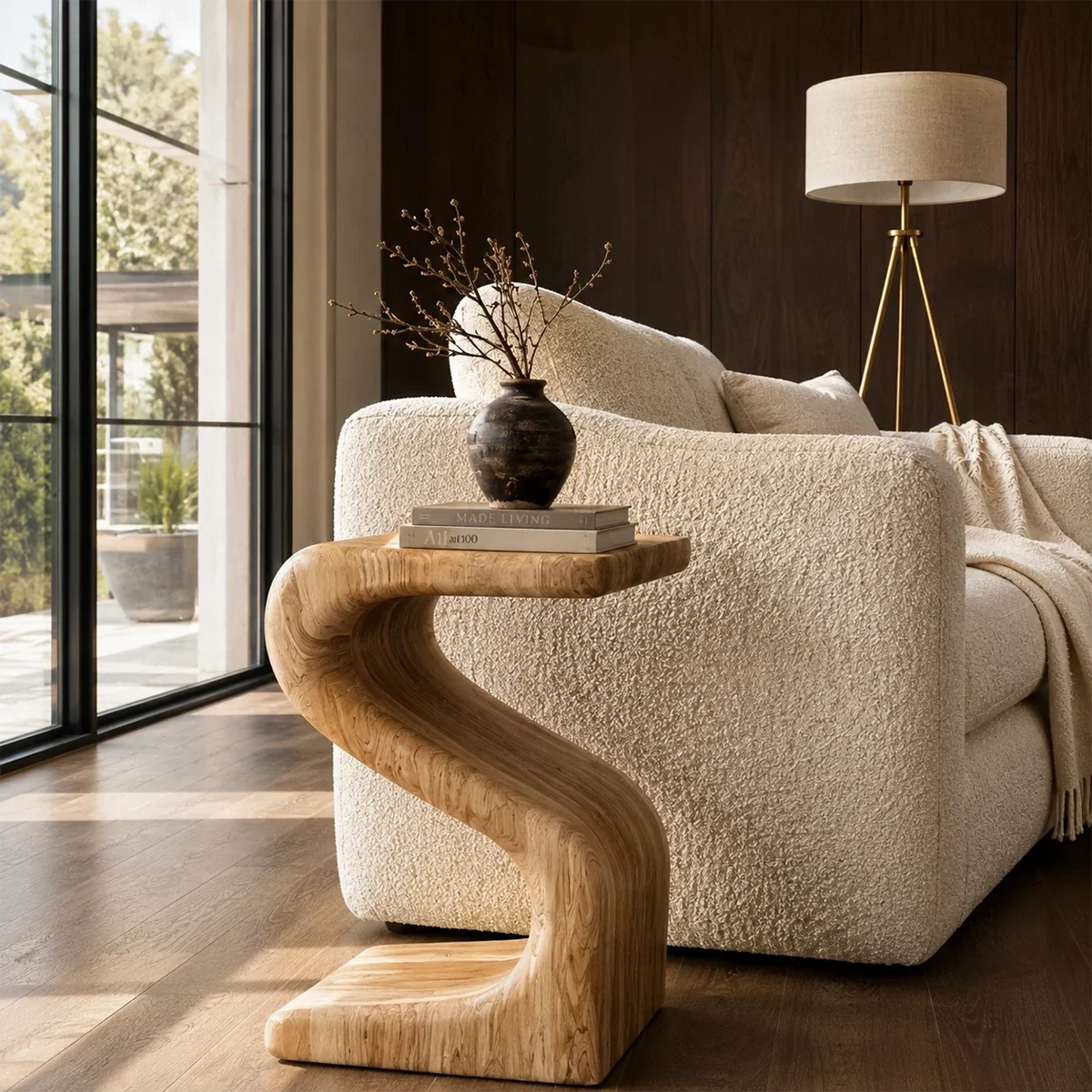 Luxury side table with a sculptural open frame and compact top in a bright interior