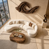 Statement wall art with sculpted wave forms adds dimension above modern living room decor