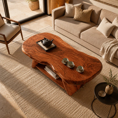 Solid wood coffee table with freeform slab top and practical lower shelf for books