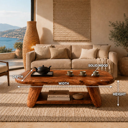 Designer coffee table with sculpted edges and open lower storage in a refined lounge