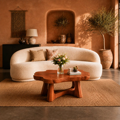 Premium coffee table with a thick freeform top and open base detail for stylish interiors