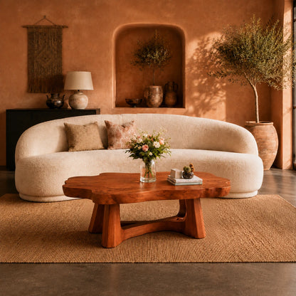 Sculptural coffee table with flowing edges and bold wood supports for modern rooms