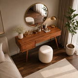 Designer makeup table with visible grain and brass handles in a refined interior
