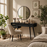 Vanity table with slim legs and organized makeup storage in a bright neutral bedroom