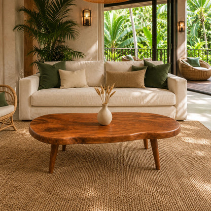 Handcrafted coffee table with sculpted solid wood form and relaxed resort styling