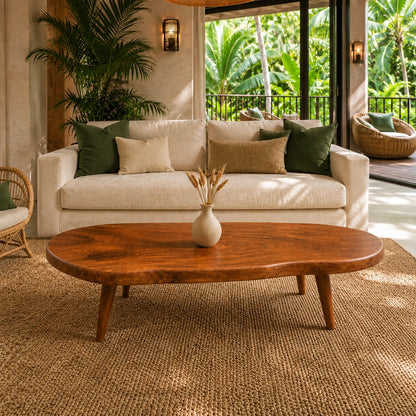 Rustic modern coffee table with an organic slab top and tapered solid wood legs