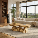 Statement coffee table with a thick freeform top and sculptural wood base design