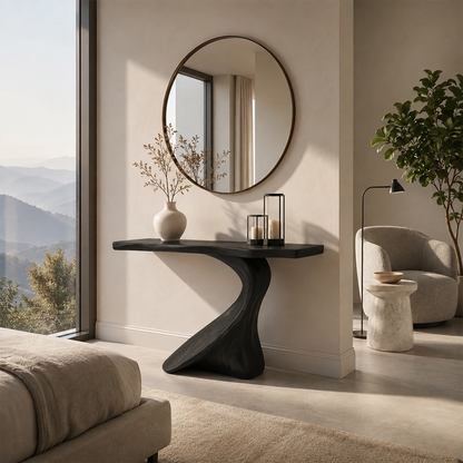 Curved console table styled with decor in a luxury room with coastal scenery indoors