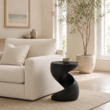 Contemporary end table showcases organic curves and warm wood tone in an airy room