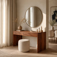 Minimalist dressing table with clean lines and hidden storage beneath a round mirror