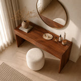 Designer makeup table with visible grain and streamlined storage in a calm interior