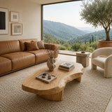 Living room coffee table with thick freeform surface and handcrafted solid wood base