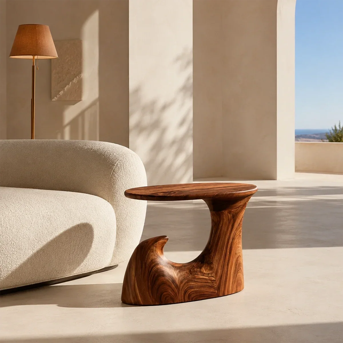 Curved side table adds fluid character and practical surface to elegant interiors