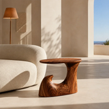Curved side table adds fluid character and practical surface to elegant interiors